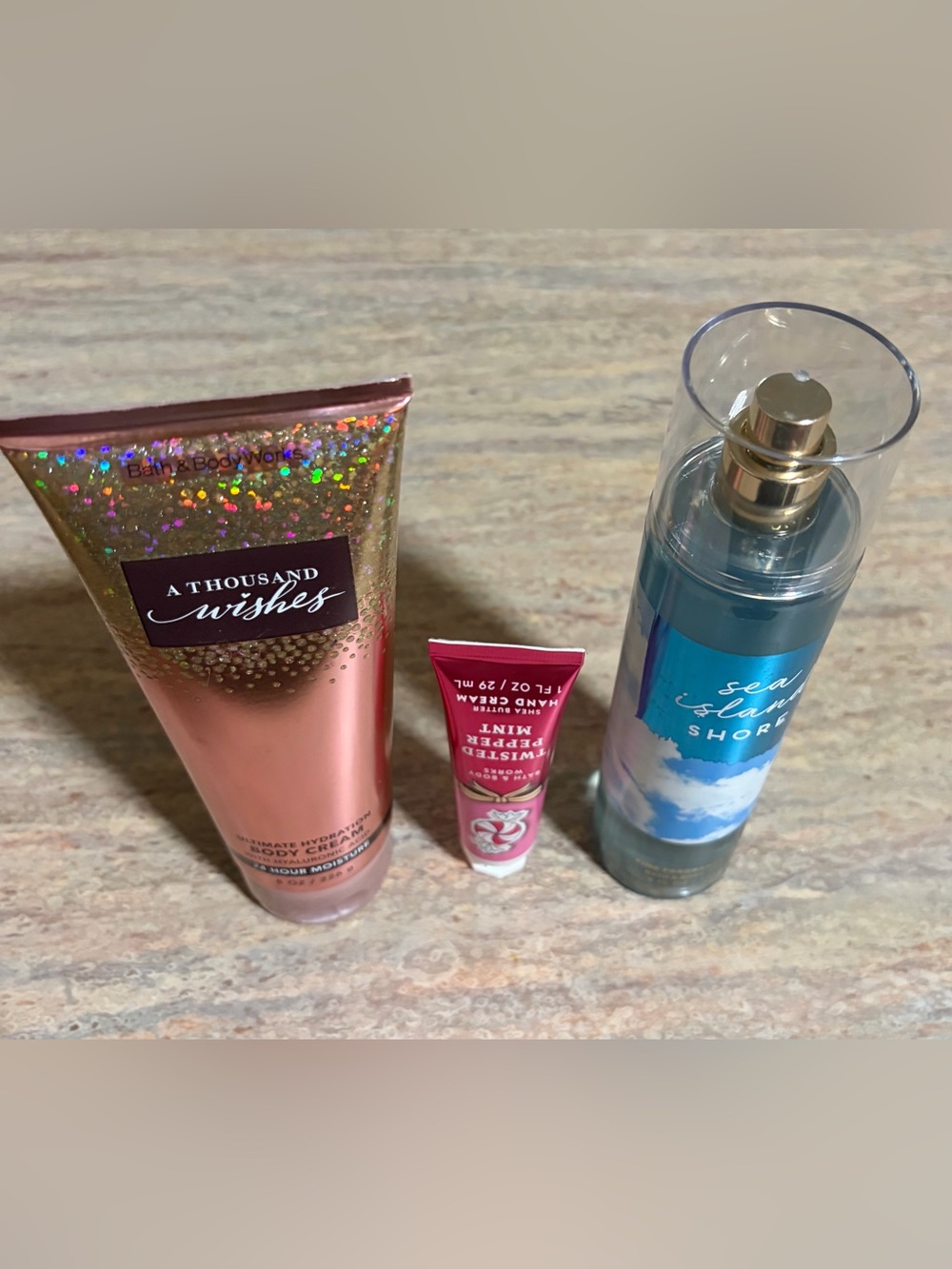 Bath & Body Works A Thousand Wishes Cream, Sea Island Shore Mist, and hand cream